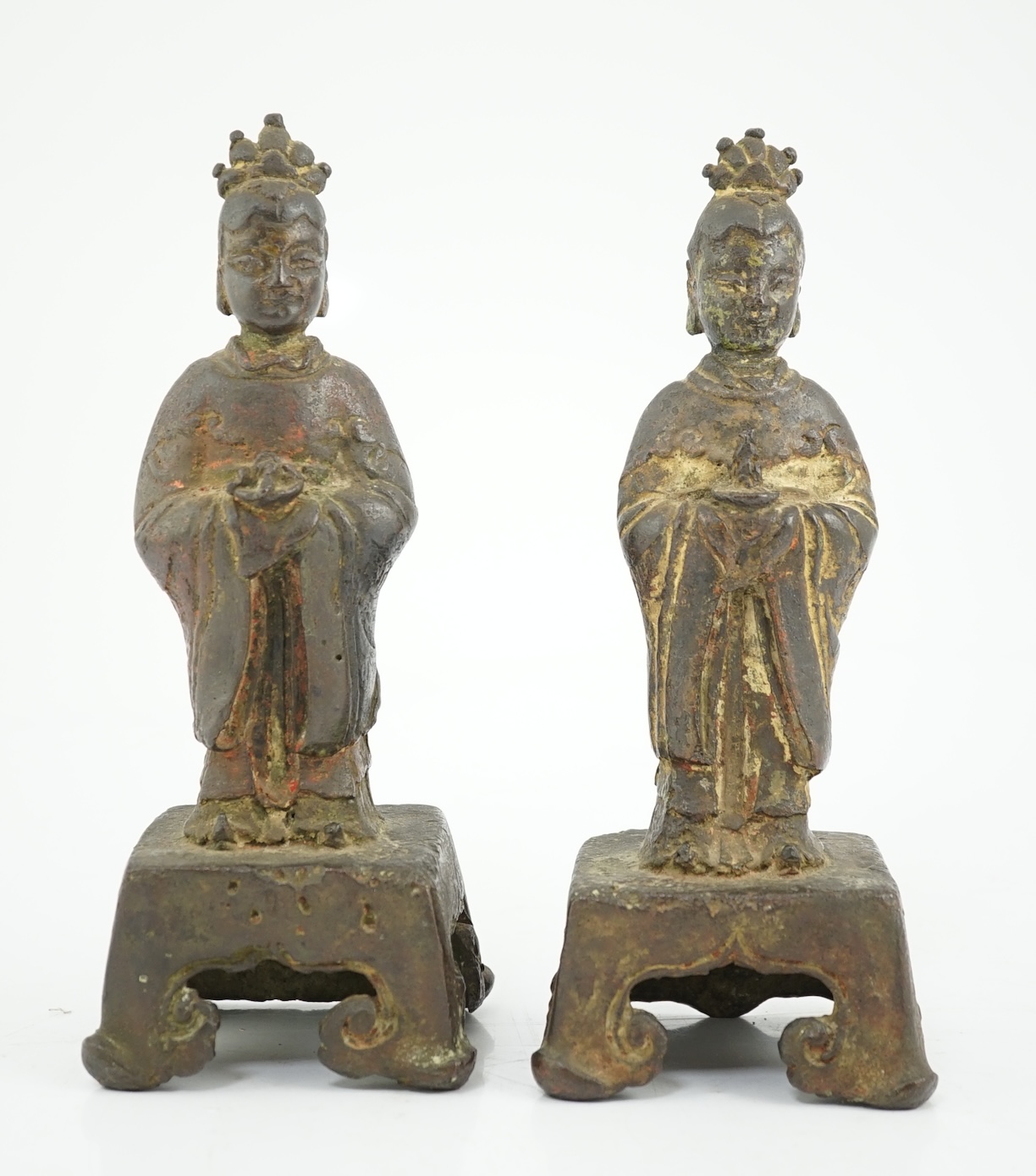 A pair of Chinese Ming bronze figures of attendants